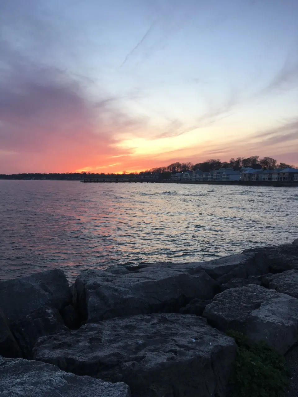 Sunset over Lake Erie with rocky shore